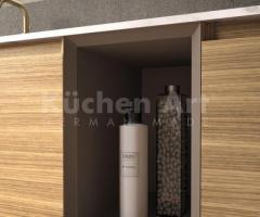 Salle de bains minimaliste avec meuble suspendu en bois clair et vasque intégrée - 6